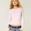 Baby-T-shirt met lange mouwen, naadloze stof en ronde hals Baby-T-shirt met lange mouwen, naadloze stof en ronde hals