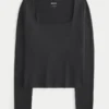 Baby-T-shirt met lange mouwen, naadloze stof en vierkante hals Baby-T-shirt met lange mouwen, naadloze stof en vierkante hals