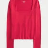 Baby-T-shirt met lange mouwen, naadloze stof en vierkante hals Baby-T-shirt met lange mouwen, naadloze stof en vierkante hals