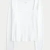 Baby-T-shirt met lange mouwen, naadloze stof en vierkante hals Baby-T-shirt met lange mouwen, naadloze stof en vierkante hals