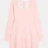 Babydoll-sweatermini-jurk met strik aan de achterkant