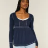 Babydoll-top met lange mouwen en henleykraag Babydoll-top met lange mouwen en henleykraag