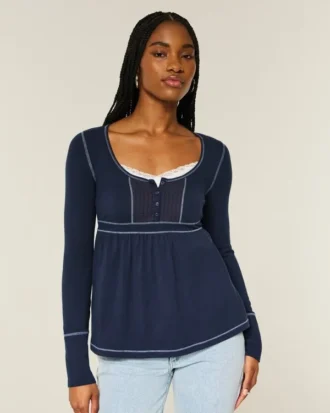 Babydoll-top met lange mouwen en henleykraag