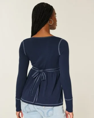 Babydoll-top met lange mouwen en henleykraag