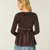 Babydoll-top met lange mouwen en henleykraag Babydoll-top met lange mouwen en henleykraag