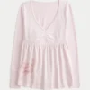 Babydoll-top met lange mouwen, grafische print en geplooide buste Babydoll-top met lange mouwen, grafische print en geplooide buste