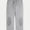 Baggy joggingbroek met dubbele slangengrafiek