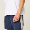 Baggy voetbalshort tot halverwege het bovenbeen Baggy voetbalshort tot halverwege het bovenbeen