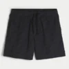 Baggy voetbalshort tot halverwege het bovenbeen Baggy voetbalshort tot halverwege het bovenbeen