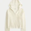 Beachy crochet-stijl trui met capuchon en V-hals Beachy crochet-stijl trui met capuchon en V-hals