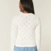 Cardigan met ronde hals en oogjes Cardigan met ronde hals en oogjes