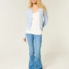 Cardigan met ronde hals en oogjes Cardigan met ronde hals en oogjes