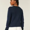 Cardigan met ronde hals en oogjes Cardigan met ronde hals en oogjes