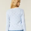 Cardigan met ronde hals en oogjes Cardigan met ronde hals en oogjes