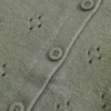 Cardigan met ronde hals en oogjes Cardigan met ronde hals en oogjes