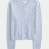 Cardigan met ronde hals en oogjes Cardigan met ronde hals en oogjes