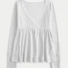 Easy babydolltop met lange mouwen en pointelle