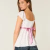Easy satijnen babydolltop met strik Easy satijnen babydolltop met strik