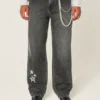 Gewassen zwarte baggy jeans met sterprint Gewassen zwarte baggy jeans met sterprint