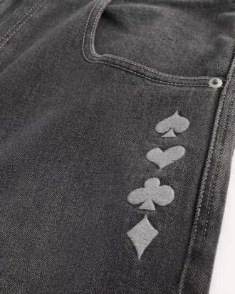 Gewassen zwarte skaterbaggyjeans met jokerprint