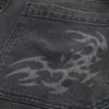 Gewassen zwarte skaterbaggyjeans met print Gewassen zwarte skaterbaggyjeans met print