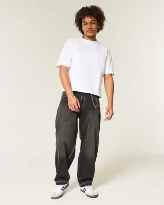 Gewassen zwarte skaterbroek met geborduurde slang