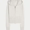 Gilly Hicks Sweater met capuchon en geschulpte zoom Gilly Hicks Sweater met capuchon en geschulpte zoom