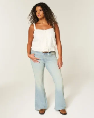 Hoge taille lichtgewassen flare jeans met sterrenzak