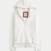 Holiday Vault Release Sherpa-gevoerde hoodie met ritssluiting en logo Holiday Vault Release Sherpa-gevoerde hoodie met ritssluiting en logo
