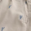 Korte broek met lobsterpatroon tot halverwege het bovenbeen