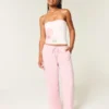 Laag uitgesneden baggy broek met elastische tailleband Laag uitgesneden baggy broek met elastische tailleband