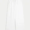 Laag uitgesneden baggy broek met elastische tailleband Laag uitgesneden baggy broek met elastische tailleband