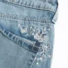 Laag uitgesneden baggy jeans met vlinderprint en medium wassing
