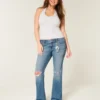 Laag uitgesneden bootcut jeans met scheuren en medium wassing Laag uitgesneden bootcut jeans met scheuren en medium wassing