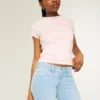 Laag uitgesneden bootcut jeans met sterrenborduursel Laag uitgesneden bootcut jeans met sterrenborduursel