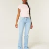 Laag uitgesneden bootcut jeans met sterrenborduursel Laag uitgesneden bootcut jeans met sterrenborduursel