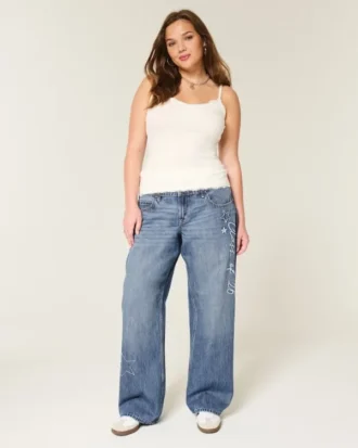 Laag uitgesneden donkerblauwe baggy jeans met ‘Class of ’26’-borduursel