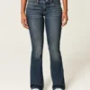 Laag uitgesneden donkerblauwe bootcut jeans met borduursels