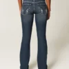 Laag uitgesneden donkerblauwe bootcut jeans met borduursels