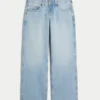 Laag uitgesneden lichtgewassen baggy jeans met studs en strikken Laag uitgesneden lichtgewassen baggy jeans met studs en strikken
