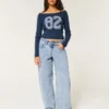 Laag uitgesneden, lichtgewassen, taps toelopende baggy jeans Laag uitgesneden, lichtgewassen, taps toelopende baggy jeans