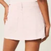 Laag uitgesneden roze denim minirok Laag uitgesneden roze denim minirok