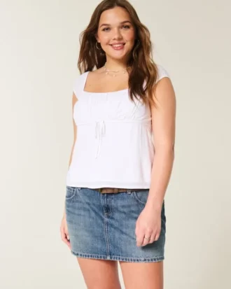 Lage broek met geborduurde denim minirok