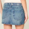 Lage broek met geborduurde denim minirok Lage broek met geborduurde denim minirok