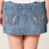 Lage broek met geborduurde denim minirok Lage broek met geborduurde denim minirok