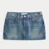Lage broek met geborduurde denim minirok Lage broek met geborduurde denim minirok