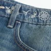Lage broek met geborduurde denim minirok Lage broek met geborduurde denim minirok