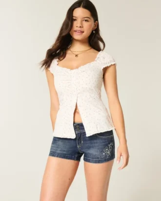 Lage taille donkerblauwe geborduurde denim short