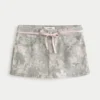 Lage taille roze mini-rok met veters en camouflageprint