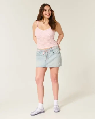 Lichtgewassen mini-rokje van denim met vetersluiting